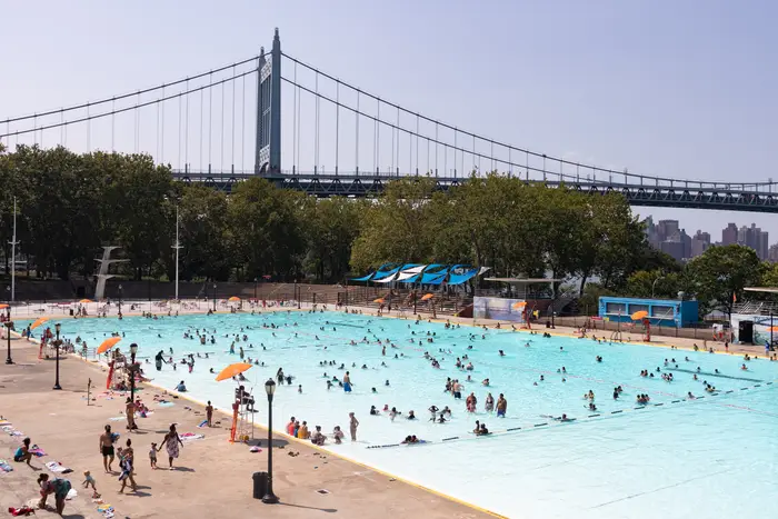 People swimming at Astoria Pool in Queens.